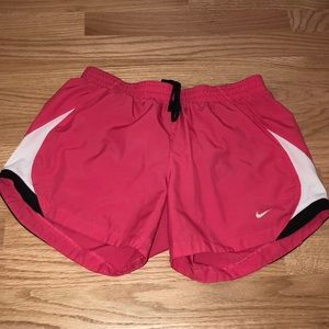 NIKE running shorts in pink with white/black sides